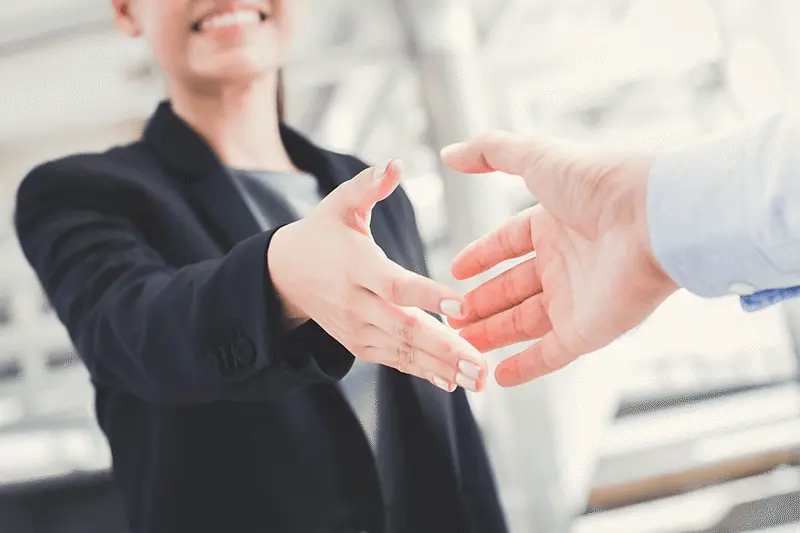 Handshake between business professionals representing responsible sourcing, supplier engagement, and collaboration across the supply chain.